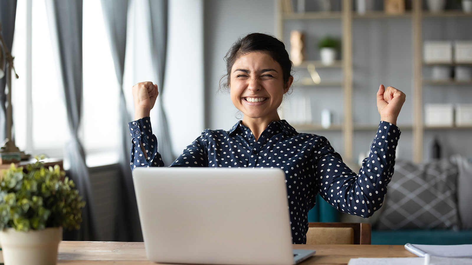 An excited woman that has just got a sale